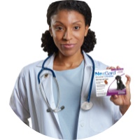 Vet holding a box of NexGard