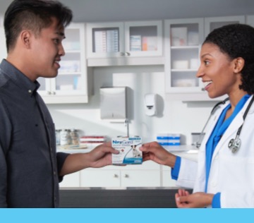 Vet giving a nexgard package to a customer 