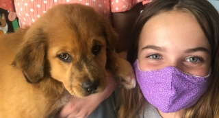 Michelle and her very cute golden retriever puppy